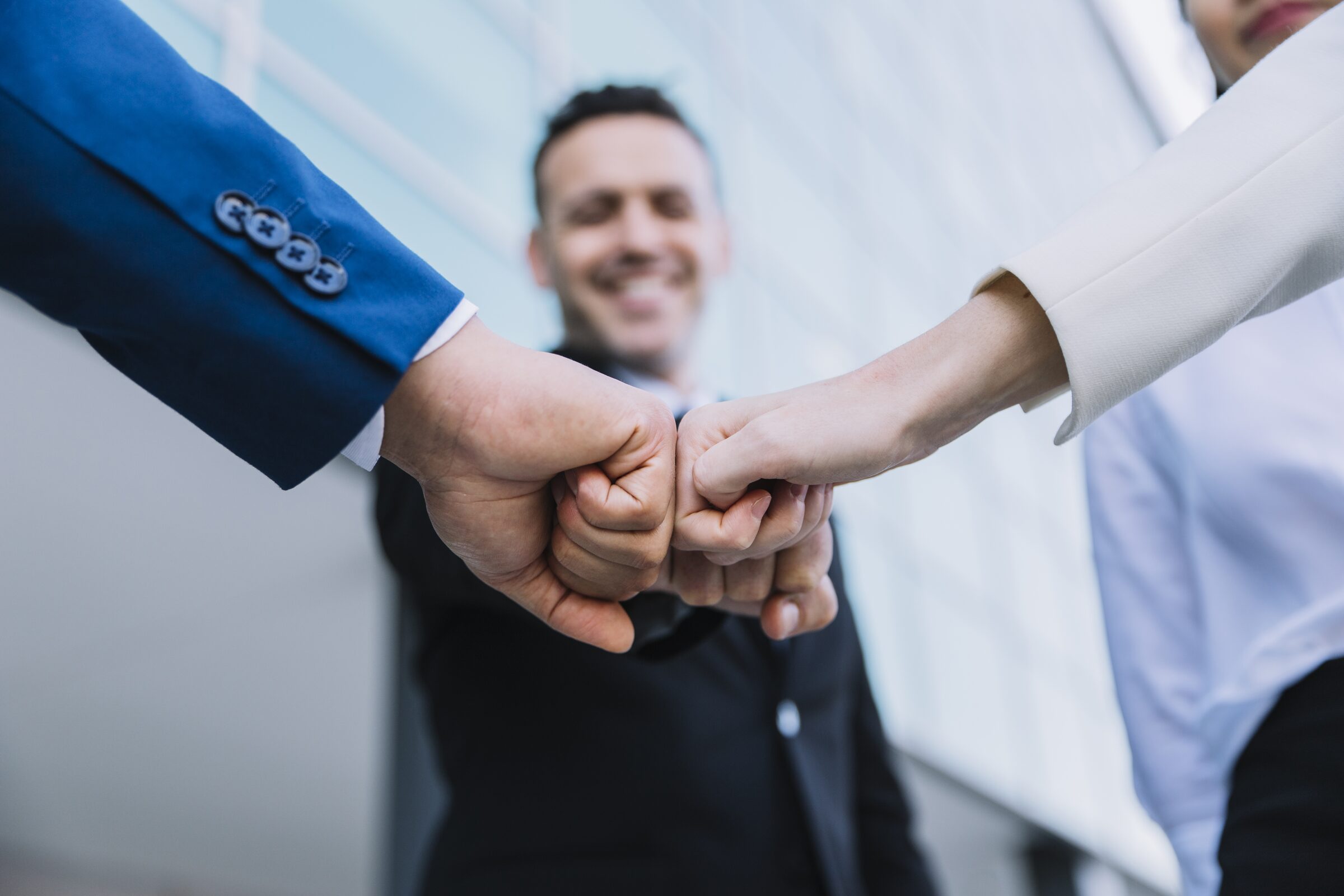 Business team joining hands in collaboration