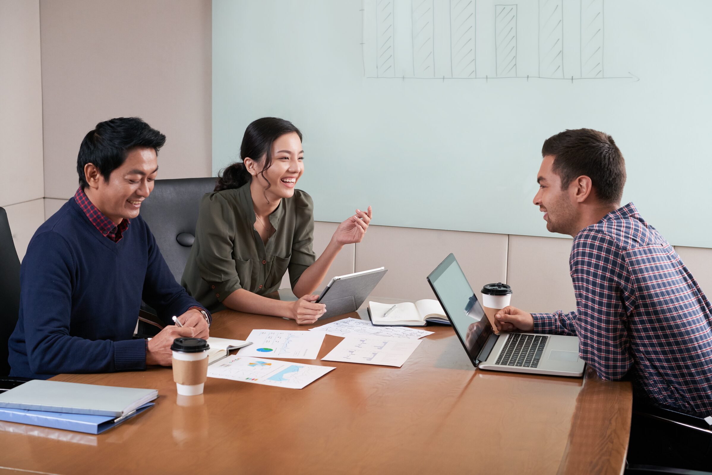 Consulting team discussing a business plan around a table